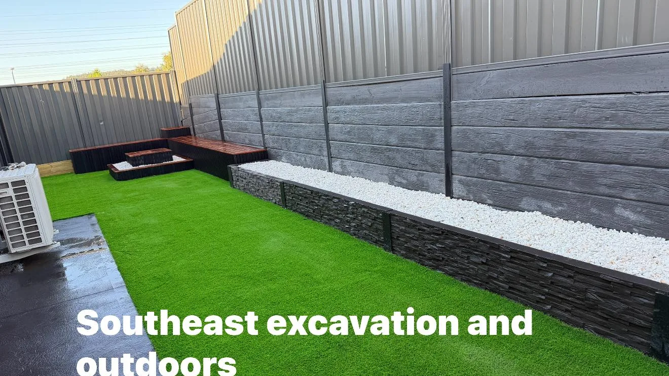 Landscaped backyard with artificial turf